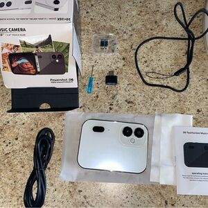 White and Black Touchscreen Music Camera